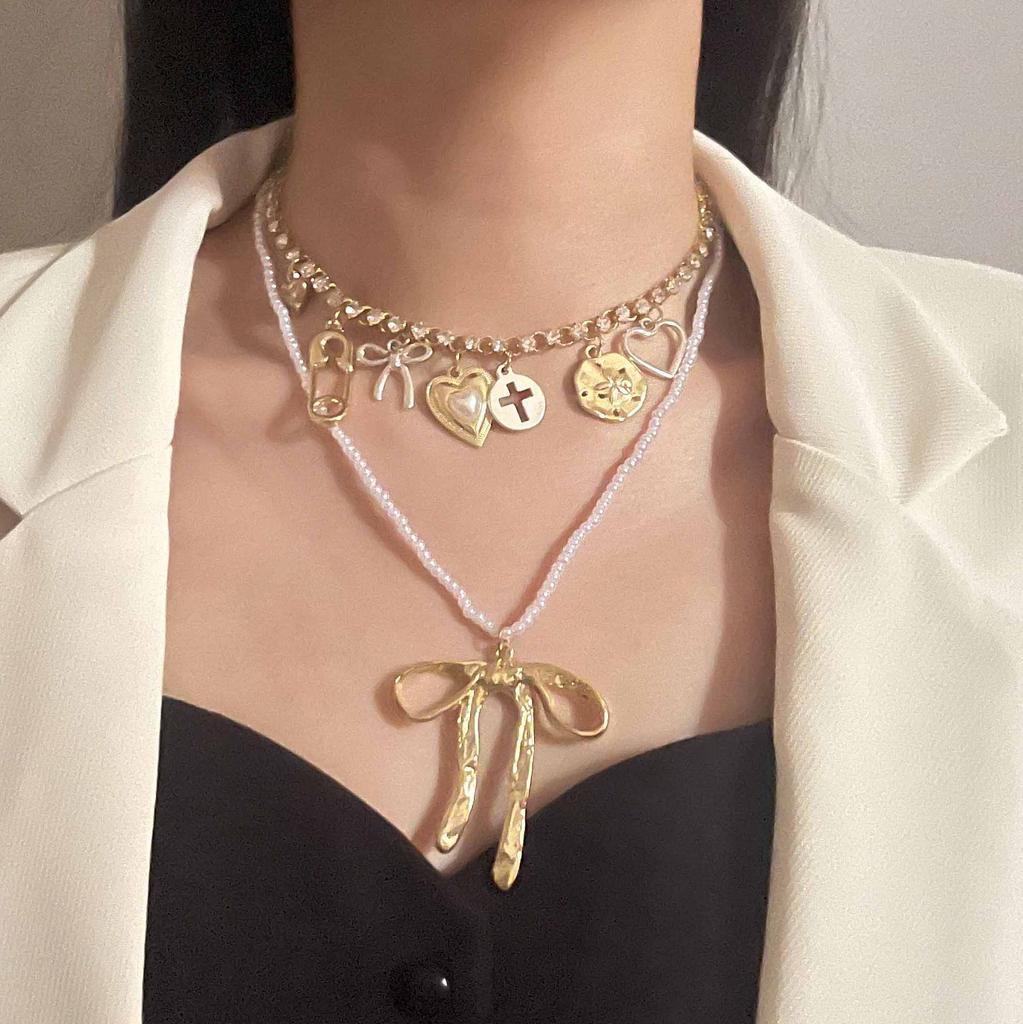 Fashion niche creative design sense double-layered alloy bow pendant necklace versatile temperament model