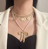 Fashion niche creative design sense double-layered alloy bow pendant necklace versatile temperament model