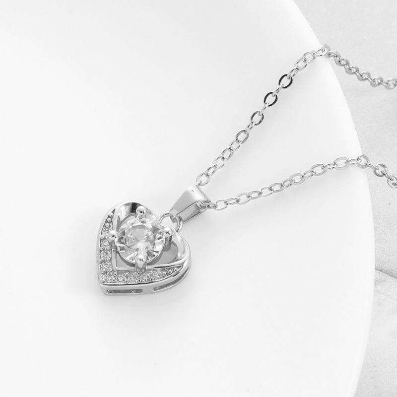 Europäischer und Amerikanischer Stil Vergoldetes Pfirsichherz Schmuckset: Kupfer-Mikro-Inlay Zirkon Ohrringe, Halskette und Ring.