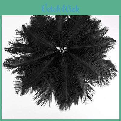 Luxe, natuurlijke struisvogelveren van 30-35 cm voor een elegante tafeldecoratie op feestjes.