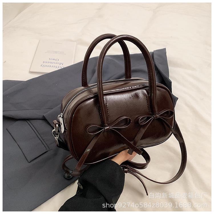 

Underarm bag single shoulder niche autumn and winter new bow portable Boston bag niche design messenger bag commuter bag