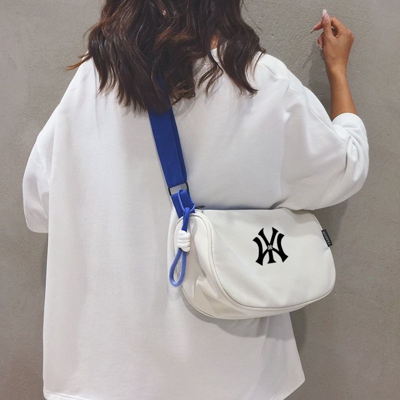 

NY & Nb Canvas Bag Women s Bag 2024 New Fashion Commuter Shoulder Pillow Bag Sports Casual Messenger Bag Fashion White with blue