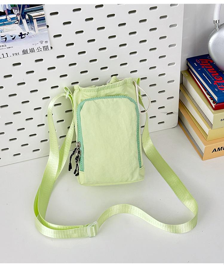 

2025 new men s and women s same crossbody shoulder mobile phone bag leisure sports outdoor portable draw strap diagonal span bag women s bag светло-зеленый
