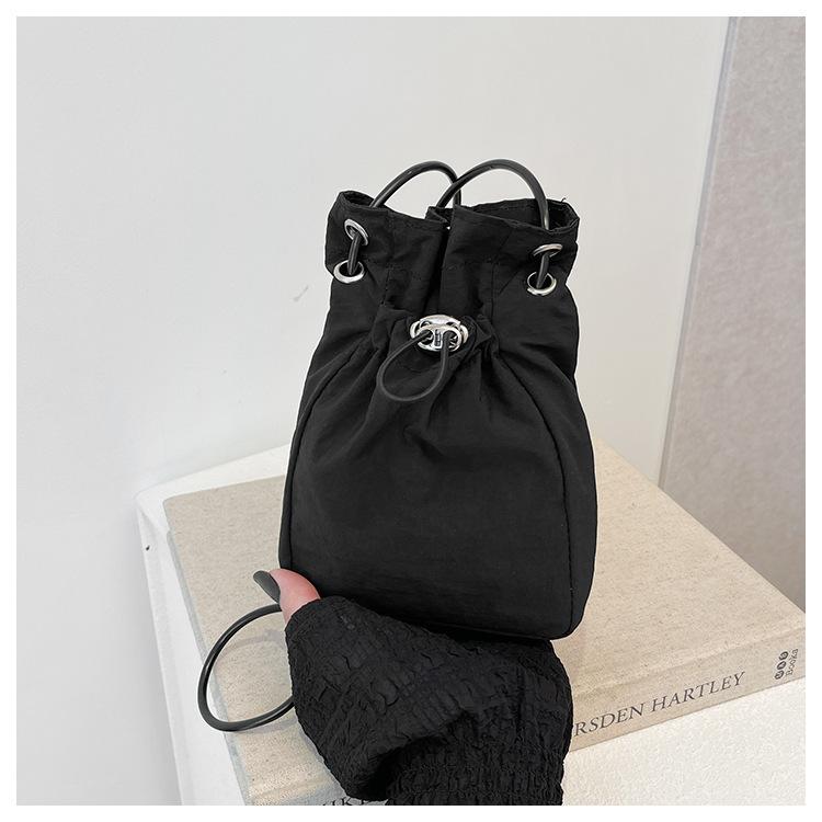 Minimalist style Japan and South Korea light drawstring canvas trend 2025 personalized solid color shoulder crossbody change mobile phone bag women's