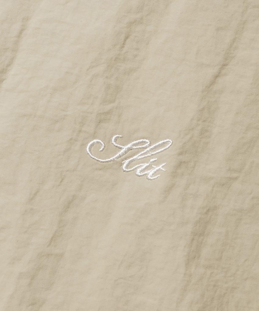 Slit Studio Lettering Windbreaker Jacket Beige