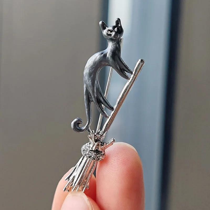 Silvery Tone Witch Cat on Broomstick Brooch - Gothic Halloween Safety Pin Charm Jewelry for Women