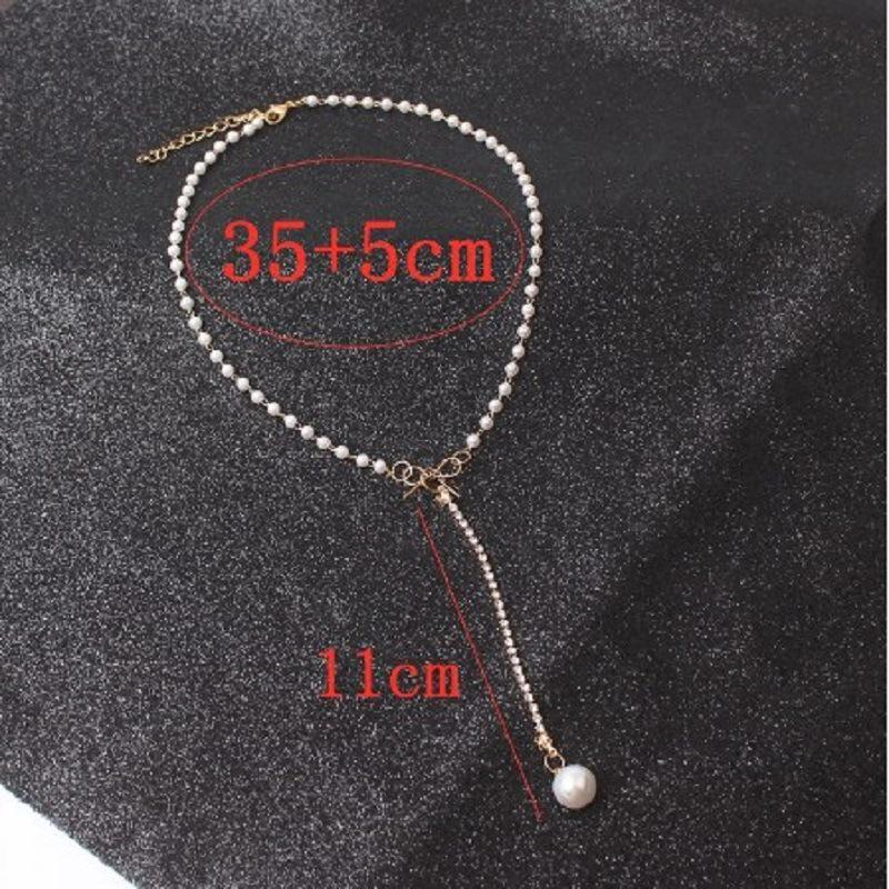 European & American Style Bow Long Pearl Tassel Choker Necklace: Fashionable Design with Clavicle Pendant for Women