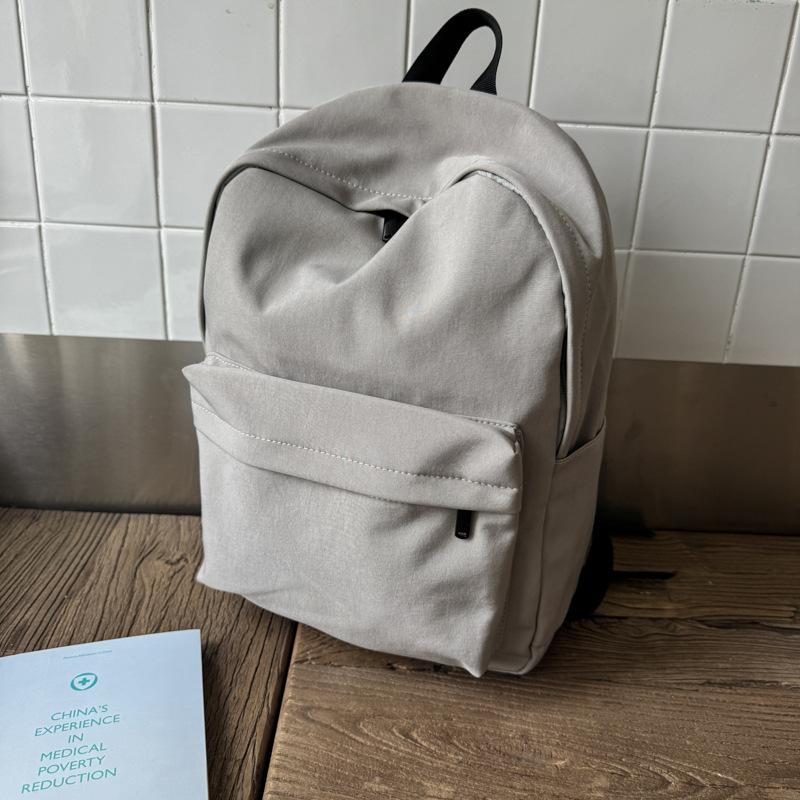 

Solid color simple backpack female junior high school student high school student college student large capacity lightweight backpack male серый