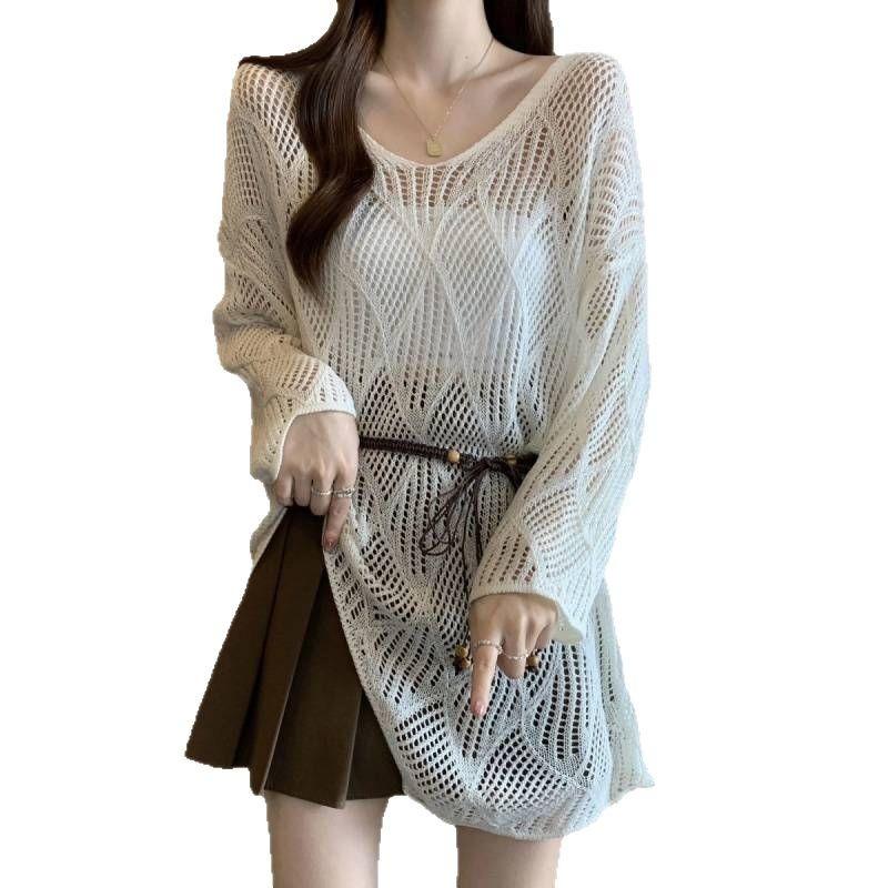 Rhombus lazy V-neck hollow long-sleeved knitted sweater women's spring and summer hem irregular sunscreen blouse knitted top