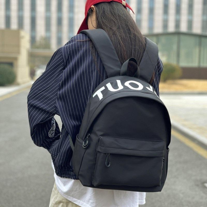 Trendy brand niche design backpack for men and women, lightweight weight weight reduction schoolbag, female college student travel small iPad backpack
