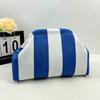 Knitted bag, striped clutch bag, women's flying woven clouds, versatile temperament, portable cosmetic bag, large capacity