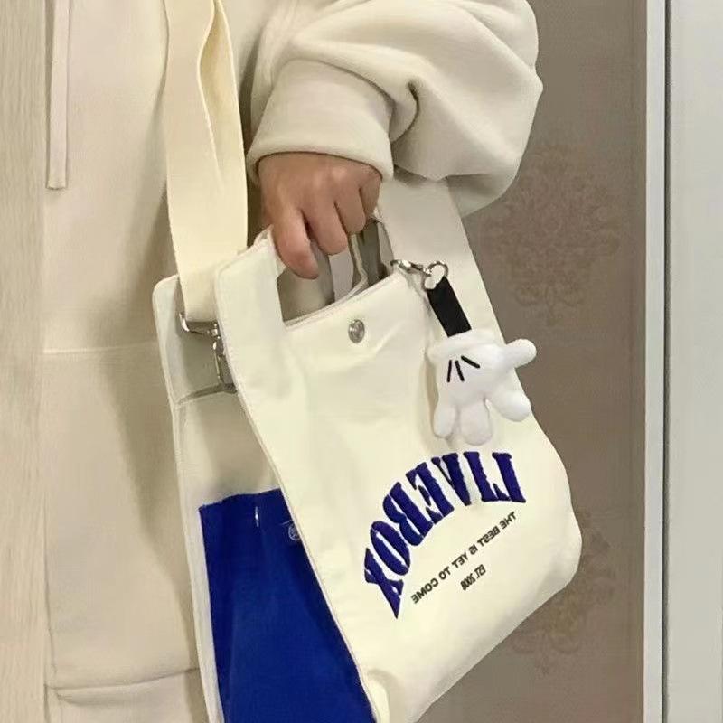 

College style bag 2022 new casual messenger bag Japanese commuter shoulder bag student class hand-held canvas bag