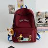 Schoolbag new cute puppy backpack large capacity primary school students junior high school students lightweight schoolbag simple fashion alphabet 