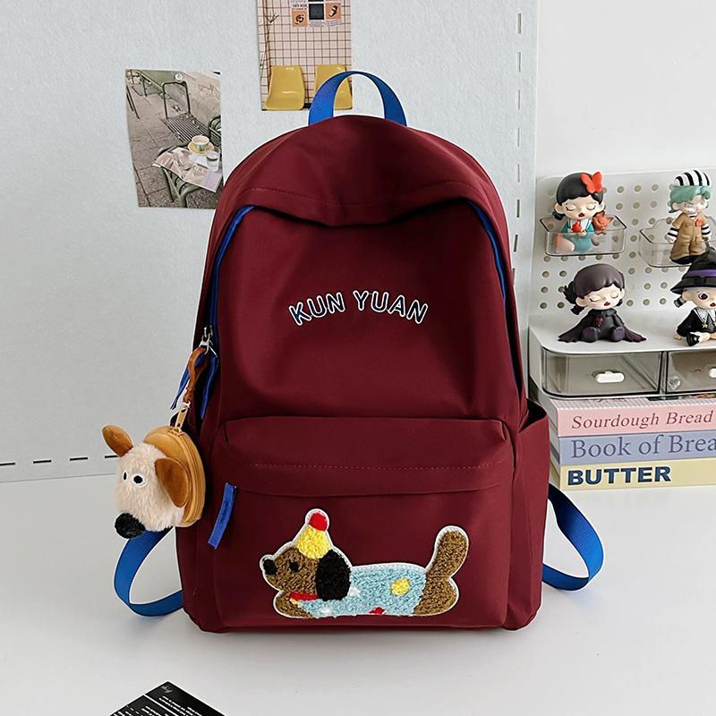Schoolbag new cute puppy backpack large capacity primary school students junior high school students lightweight schoolbag simple fashion alphabet 