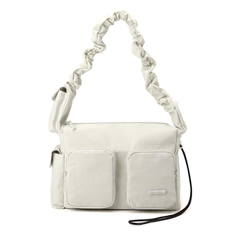 Neuer Design-Sinn einfache Damen-Tasche plissiert lässig vielseitig Nische Schulter Achseltasche