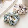 French-style smooth satin scrunchie with floral pattern, versatile elastic hair tie for women, popular on Instagram