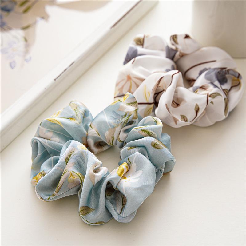 French-style smooth satin scrunchie with floral pattern, versatile elastic hair tie for women, popular on Instagram