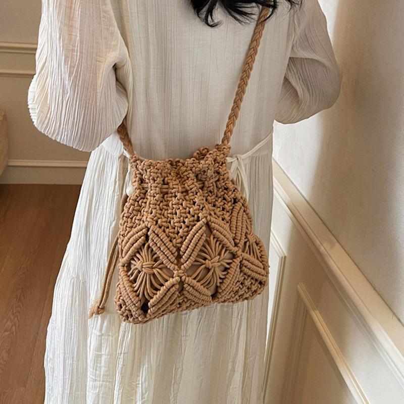 Woven straw bag women's summer versatile 2026 new fashion niche design crossbody bucket bag seaside beach bag