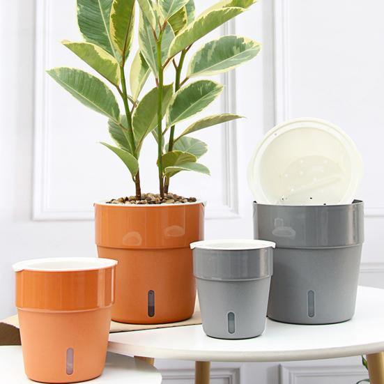 Maceta de plástico resistente al calor que llama la atención y que absorbe automáticamente el agua con cuerdas de algodón para el hogar