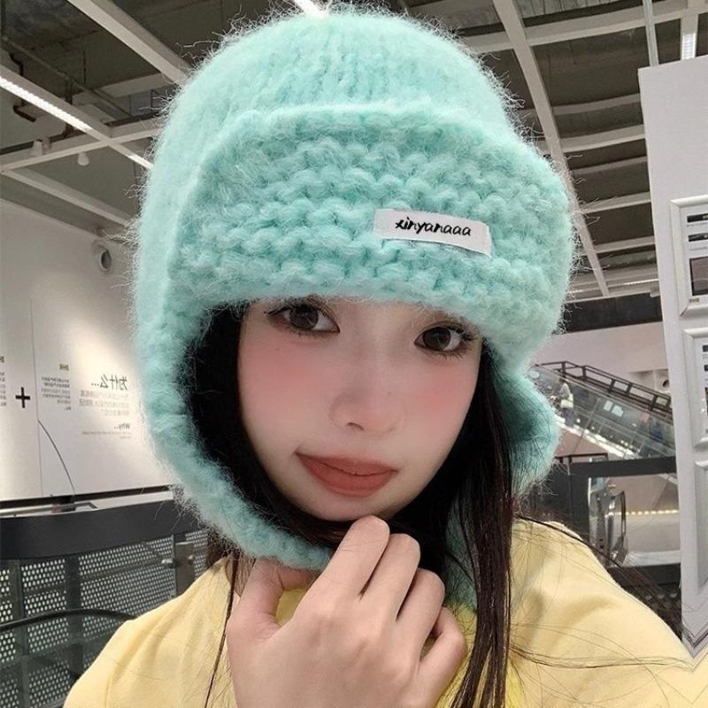 

Dopamine contrasting color knitted hat women s autumn and winter hairball ear protection wool hat keeps warm and shows a small tide
