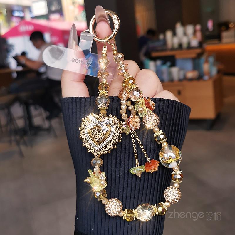 Light luxury mobile phone chain pendant women s high-value boutique handmade beaded wrist rope short outdoor travel