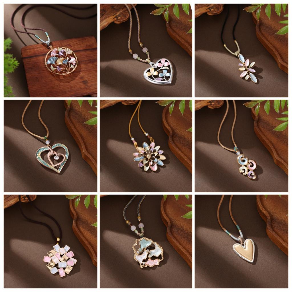 Pendentif long fleur géométrique creuse couleur émail, pendentif collier polyvalent en forme de cœur pour femme à sens élevé