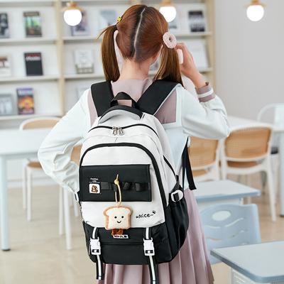 2025 Sommer Neue Hochwertige Junior High School Schüler Schultaschen Mode Kontrastfarbe Mädchen Büchertasche Einfache Tragbare Nylon Rucksäcke mit Anhänger