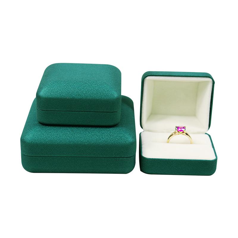 Kulatý roh PU kožená šperkovnice na prsteny, náhrdelníky a náramky