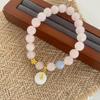 Elegant Forest-Style Pink Stone Beaded Bracelet with Sand Gold Flower - Fresh, Sweet, Versatile Jewelry for Women.
