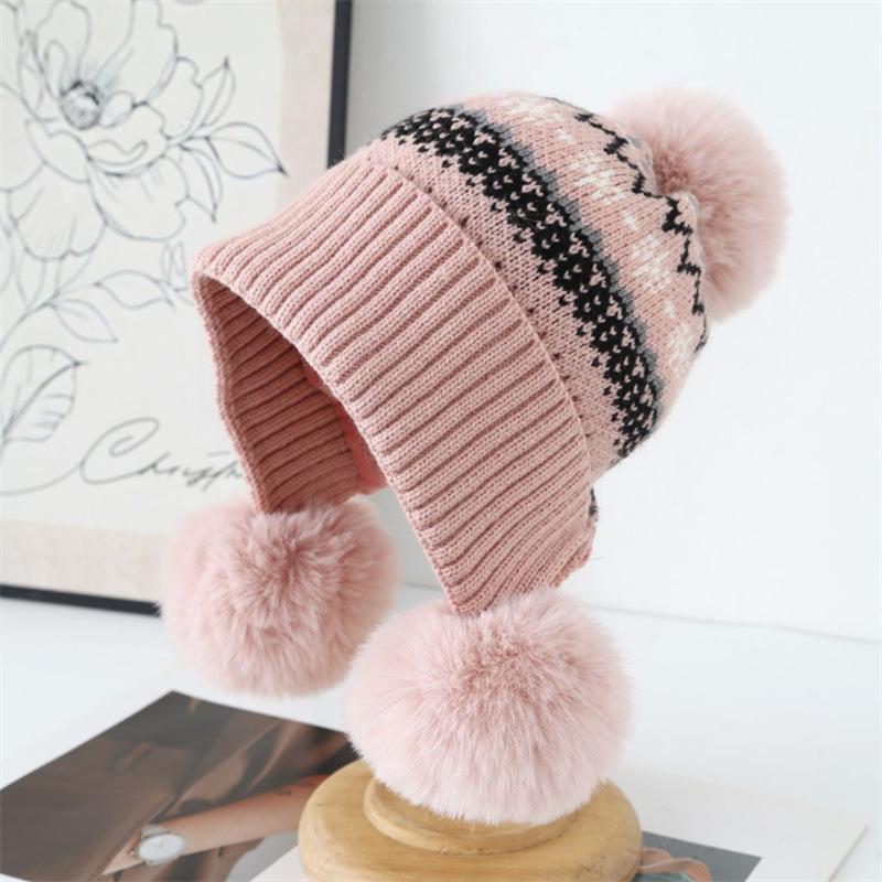 Autumn and winter jacquard knitted hat girls sweet hairball pullover hat piled and thickened Fair Island cold-proof ear protection wool hat