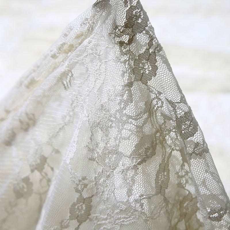 Embroidered lace fabric with hollowed-out patterns can be used for wedding dresses evening gowns and designer clothing fabrics