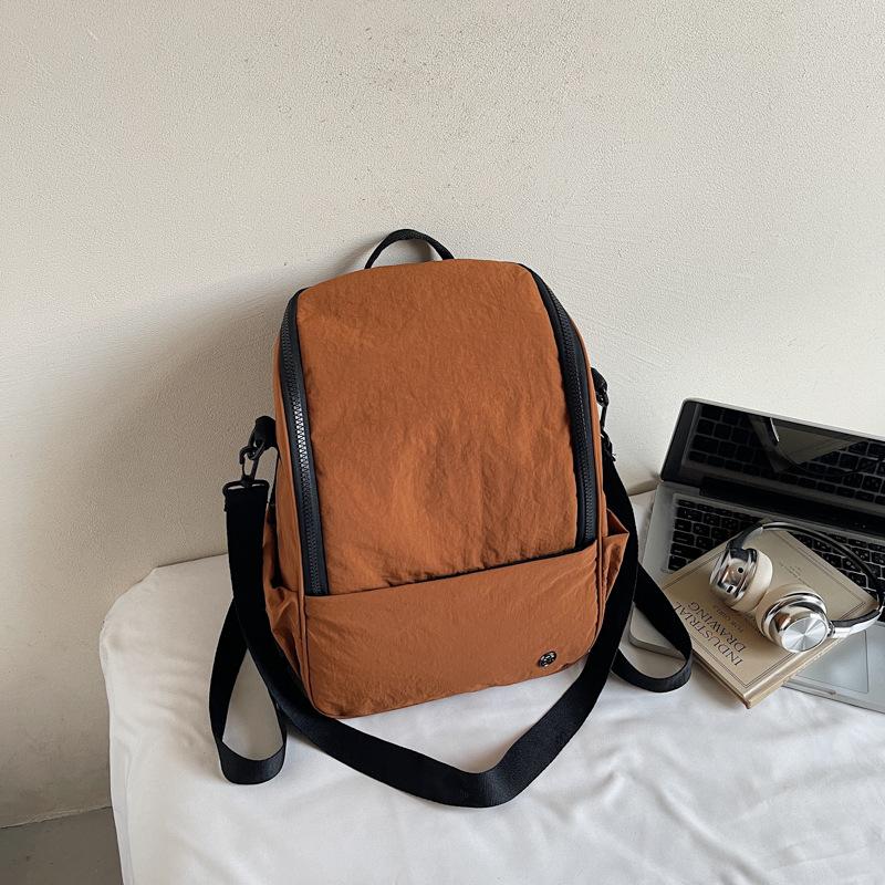 

Новый рюкзак универсальная дорожная сумка большой вместимости легкая водонепроницаемая нейлоновая сумка повседневный рюкзак тренд коричневый