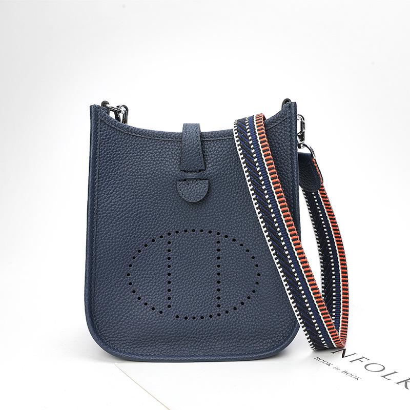 Factory wholesale first layer togo cowhide bucket bag women's bag lychee pattern hollow single shoulder crossbody bag hollow design