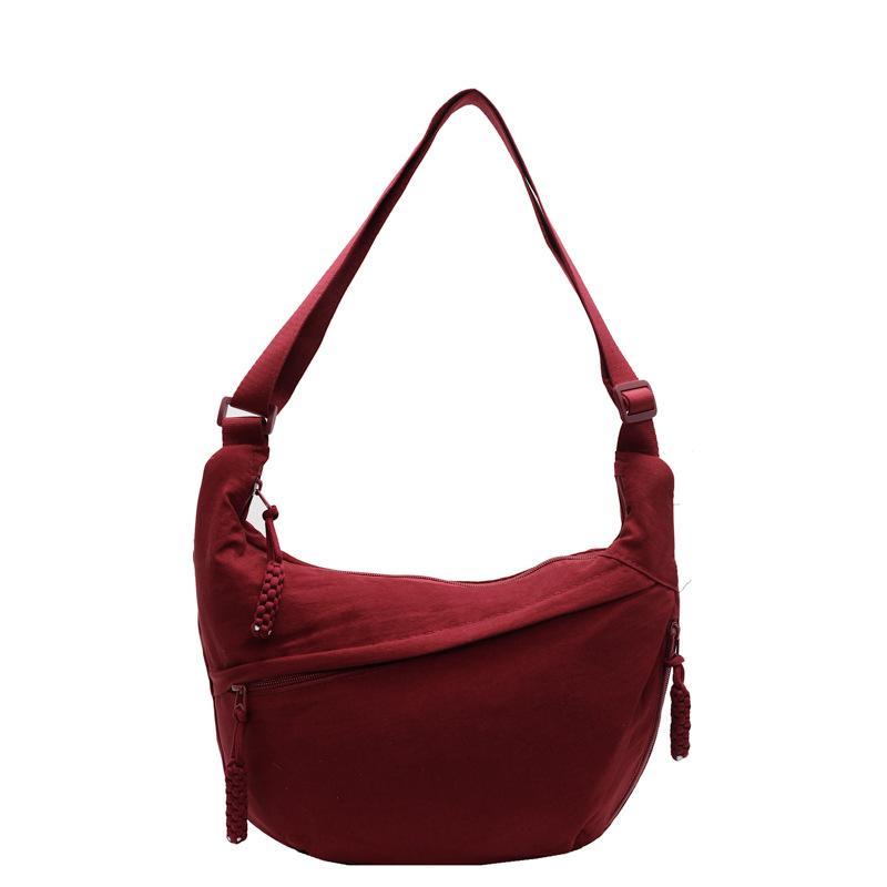 Trendy new products ins simple fashion lightweight sports style dumpling bag leisure travel versatile solid color messenger bag women