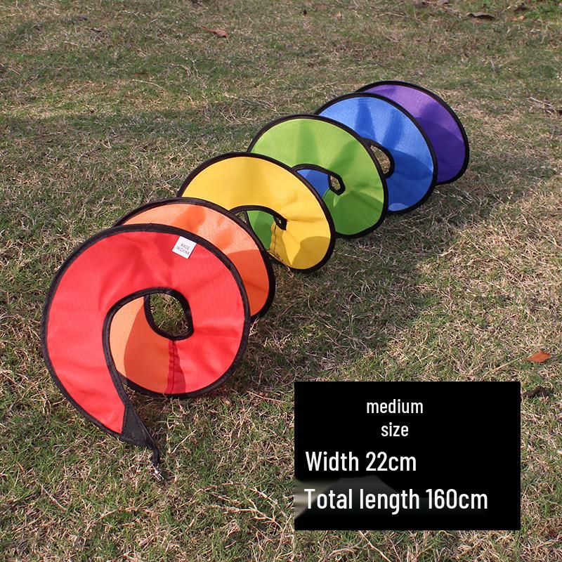 

Colorful Outdoor Tent Accessories: Anti-Trip Guy Ropes, Warning Flags, Wind Spinner, and Decorative Pennants.