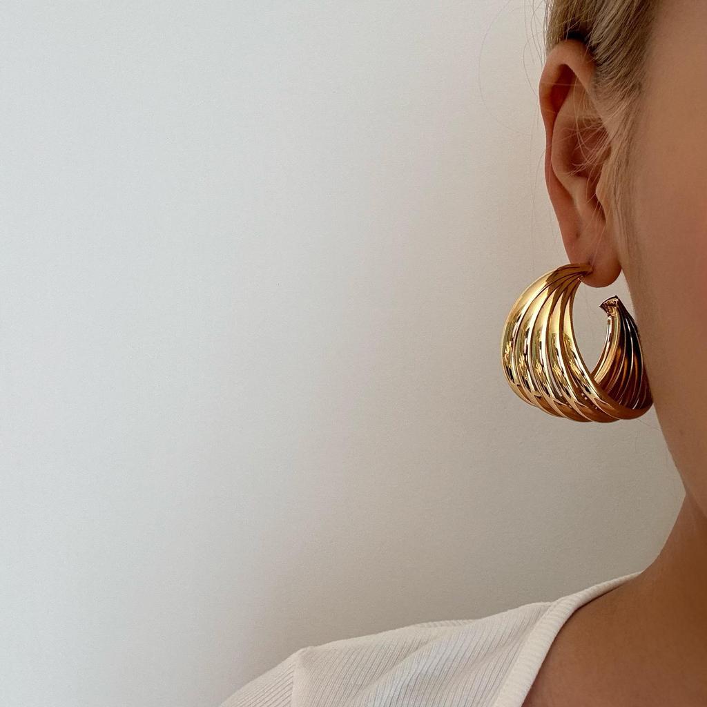 European & American Retro Metal Twisted Hoop Earrings for Women - Bold, Versatile, and Stylish Accessory.