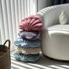 A seashell-shaped pillow, suitable for living room sofas, bedrooms, offices, and home decor.