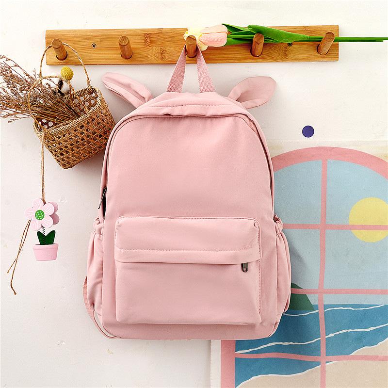 Schoolbag Korean fashion backpack 1011 new rabbit ears solid color backpack trendy campus personalized student bag