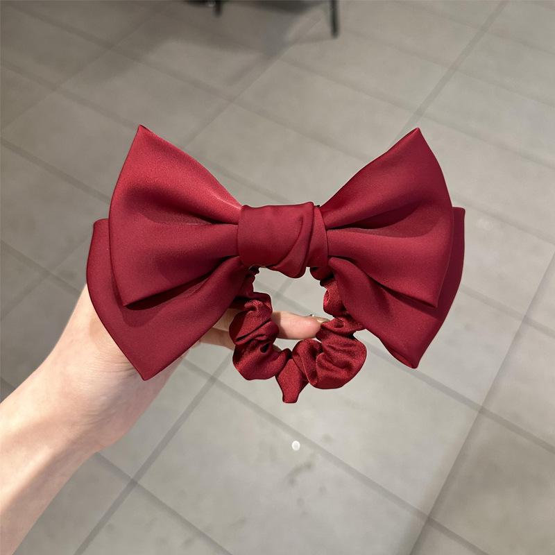 

Black Bow Hair Tie: Elegant Ponytail Holder & Rubber Band for Women