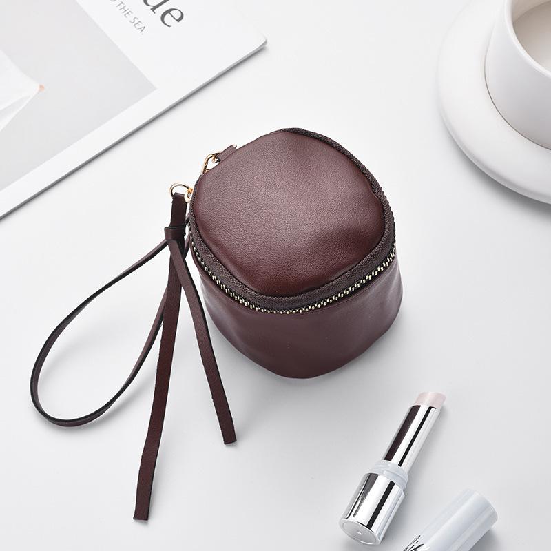 Retro Handheld Coin Purse with Wenge Beads, Flocked Leather Mini Key Holder, and Large Capacity Earphone Pocket Envelope.
