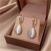 Elegant, Minimalist Drop-shaped Drop Earrings with A Double-sided Cat's Eye Stone in 18K Metal.… More