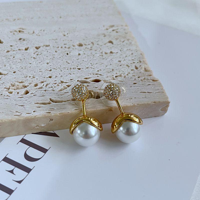 

Элегантные съемные серьги со стразами и жемчугом золотой