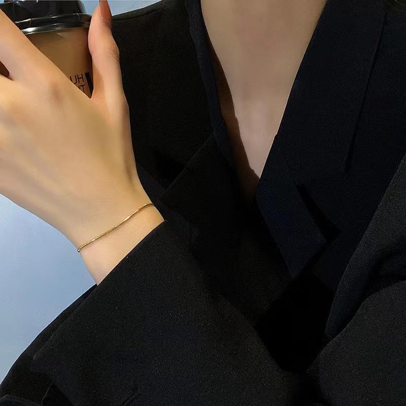Women's Gold Snake Bone Chain Bracelet/Anklet - 2023 High-End Titanium Steel, Non-Fading, Niche Design.