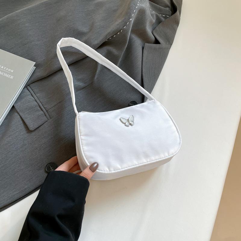 

Niche design textured bag women s 2025 spring new daily simplicity with casual shoulder pleated armpit bag белый