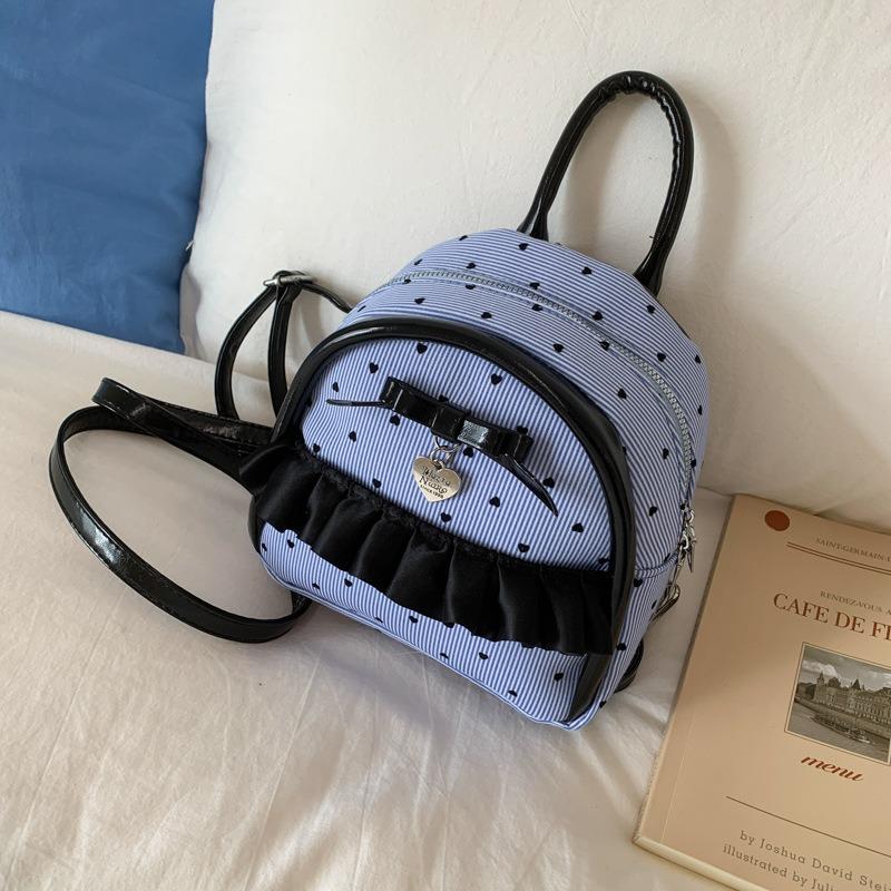 New college student schoolbag female junior high school student fashion polka dot backpack simple large capacity class commuter back