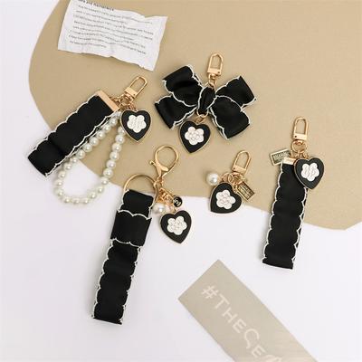 Porte-clés Rétro Noir Amour Mode Ruban Nœud Pendentif Nacré pour Femmes Filles Ornement pour Étui d'Écouteurs Porte-clés Cadeau Couple