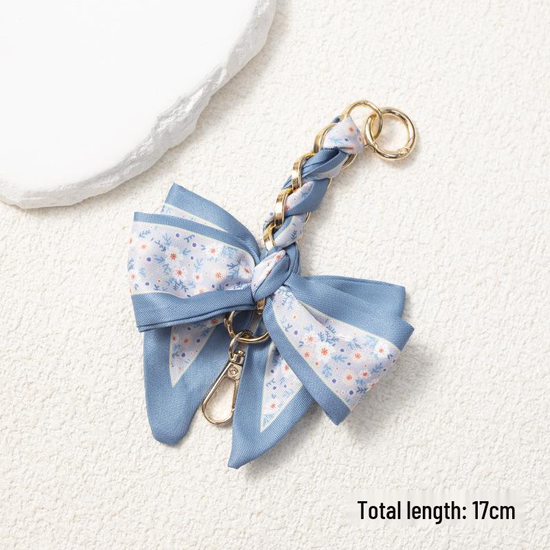 Elegant Hand-Woven Scarf Chain with Bow Decoration Pendant for Bag Strap Modification.