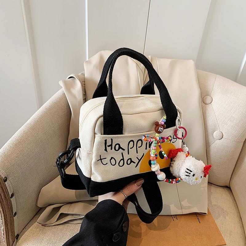 Cute Smiley Girl Handbag Hand Carry Out High Value Canvas Bag Korean Version Printed Trend Shoulder Messenger Bag