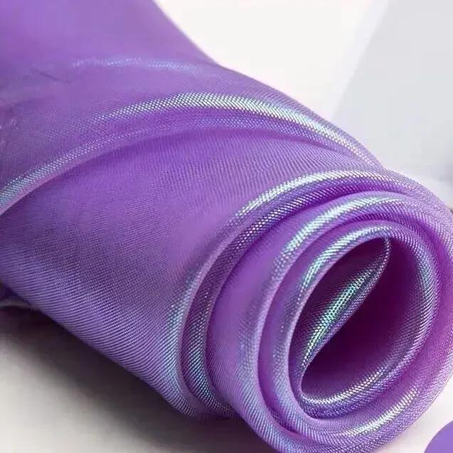Buntes glitzerndes Netzgewebe Illusionäre Farbfotografie Hintergrund Transparentes Gaze-Kleid Performance-Kleidung Stoff