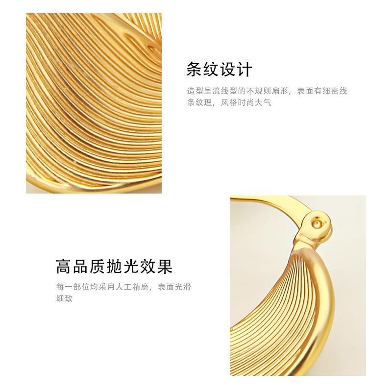 Hong Kong style non-standard twisted circle earrings women, retro light luxury copper plated real gold personalized striped earrings high sense
